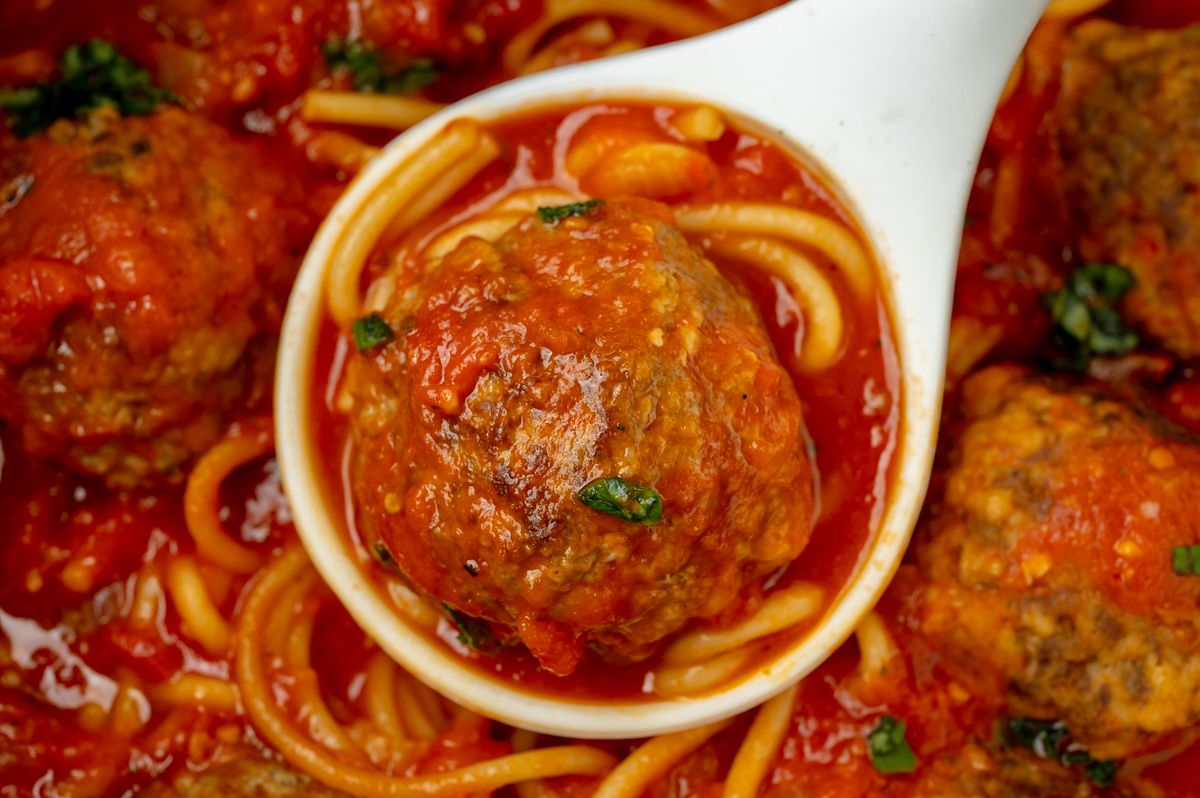 close up of instant pot spaghetti and meatballs in ladle