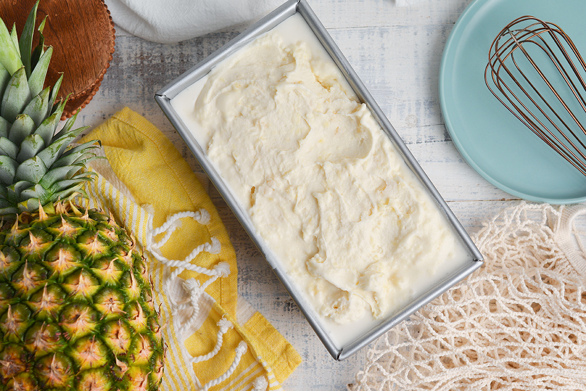 overhead shot of loaf pan of pina colada ice cream