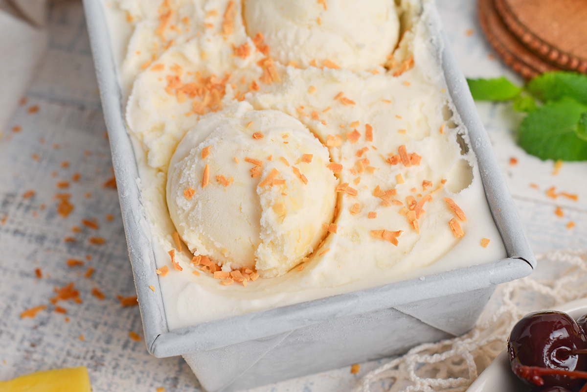 close up angled shot of scoop of pina colada ice cream