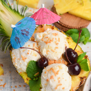 close up overhead shot of pina colada ice cream in pineapple