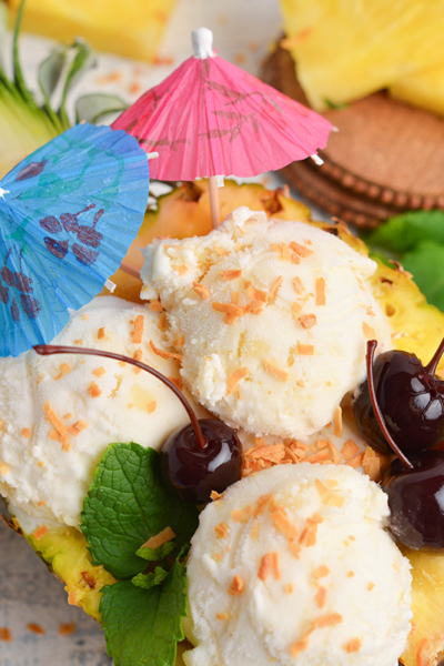 close up overhead shot of pina colada ice cream in pineapple