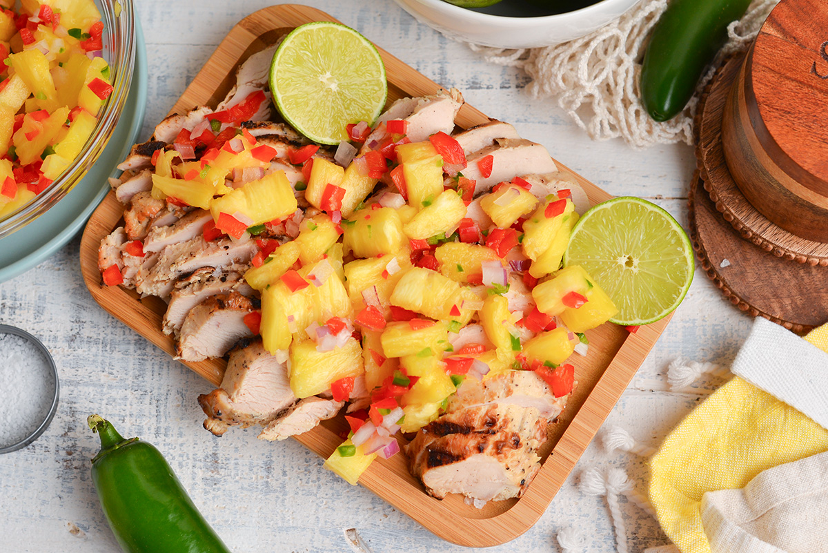 overhead shot of salsa over sliced chicken