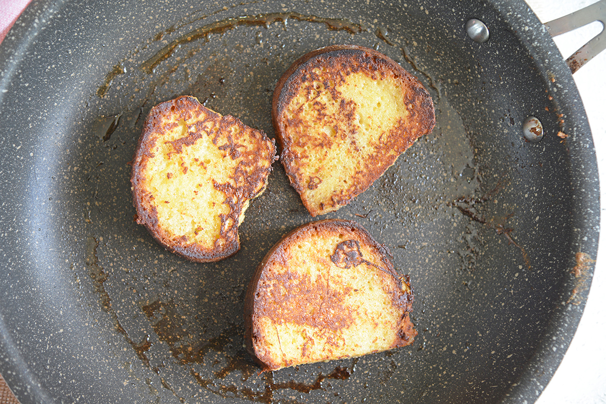 pound cake french toast cooking in pan