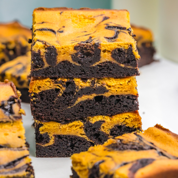 stack of three pumpkin cheesecake brownies