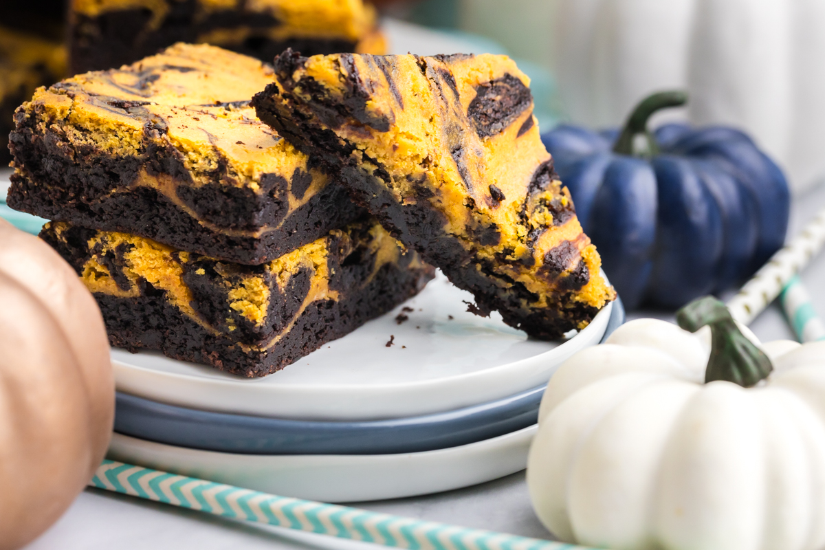 angled shot of stack of brownies on plates