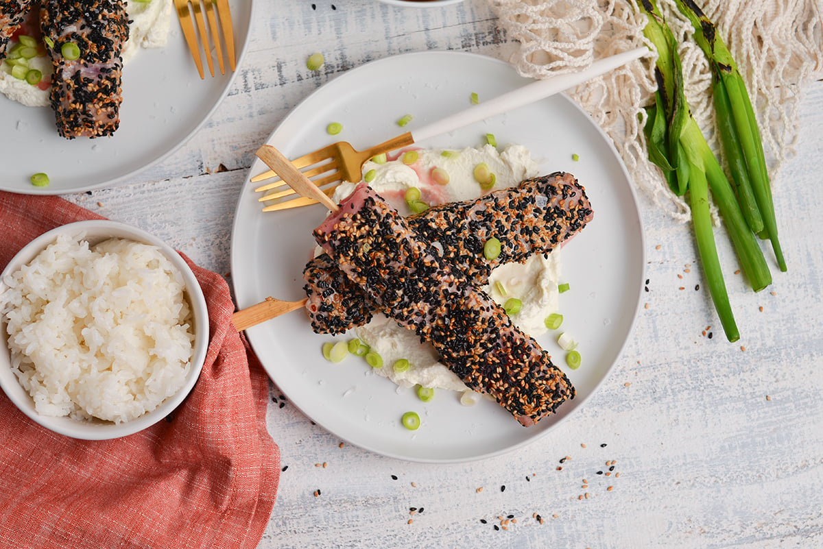 overhead shot of sesame crusted tuna sticks on plate