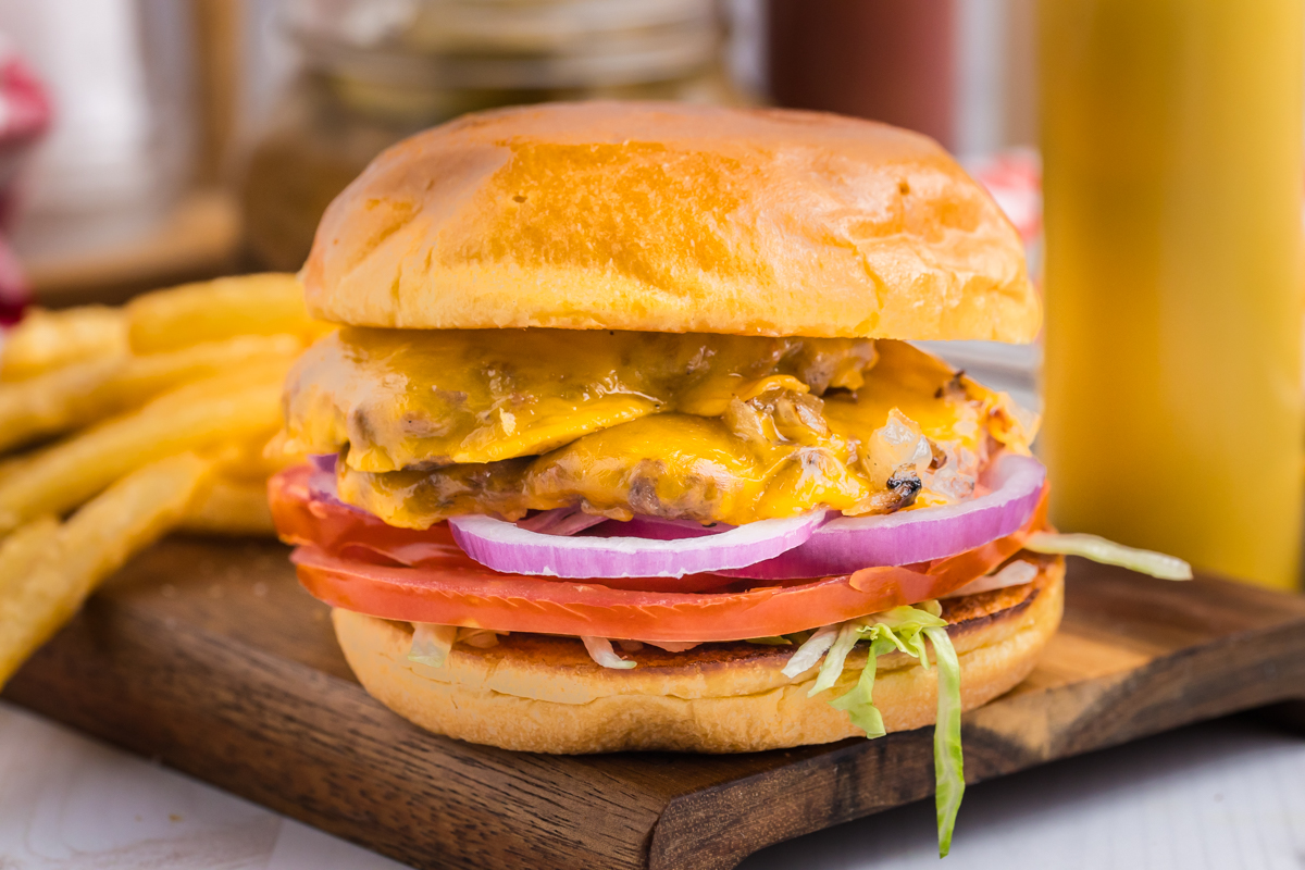 straight on shot of smash burger on wooden board