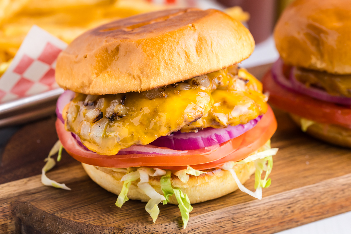 close up straight on shot of smash burger on wooden board