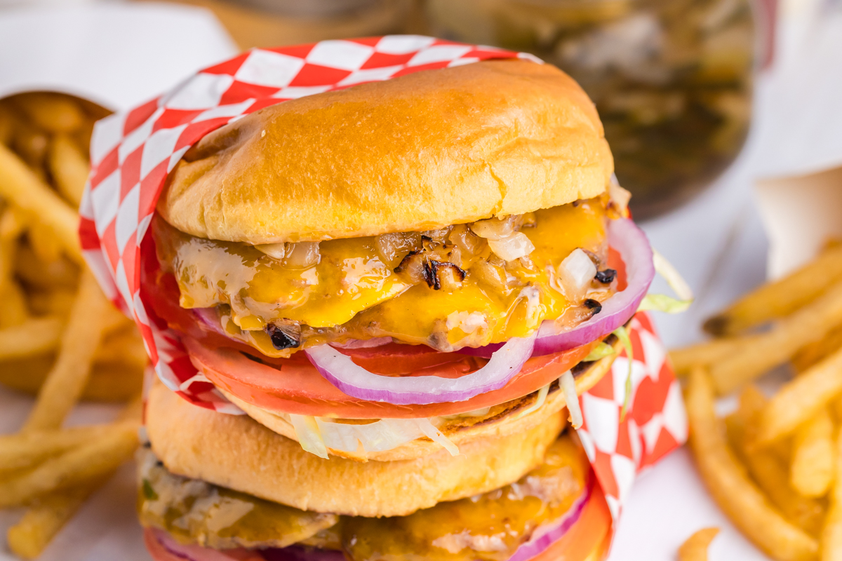 angled shot of stack of two smash burgers