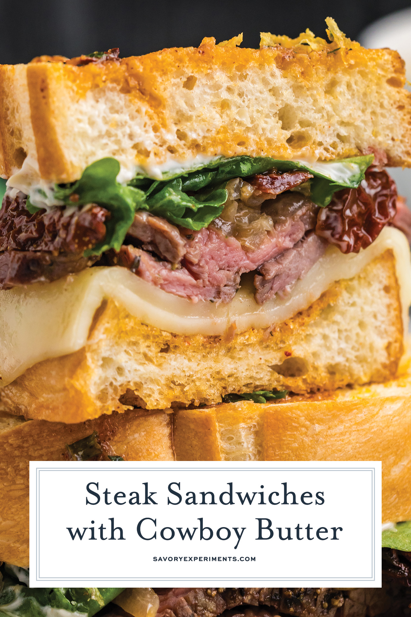 straight on shot of stack of steak sandwich halves with text overlay