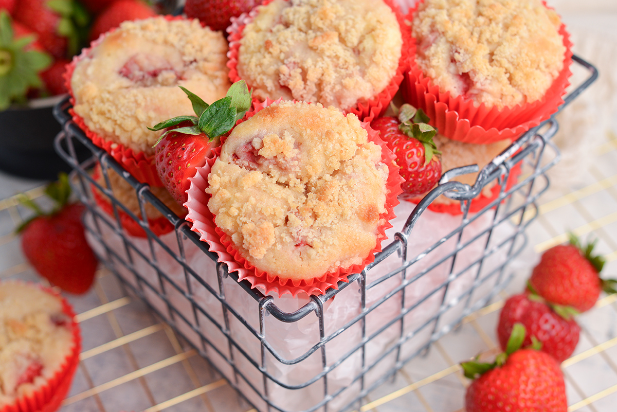 angled shot of basket of strawberry muffins