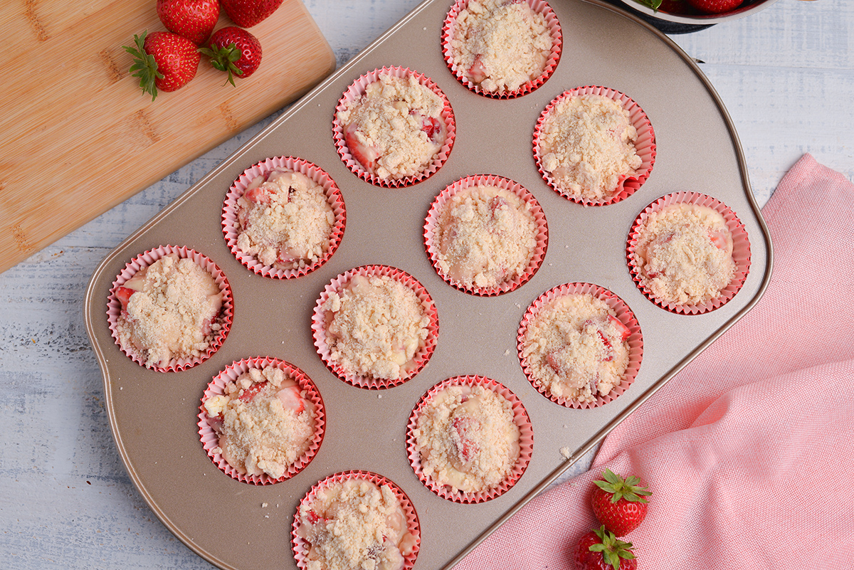 streusel on strawberry muffins in pan