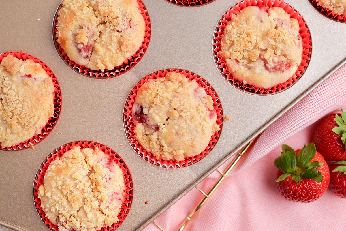 close up overhead shot of strawberry cream cheese muffins in pan