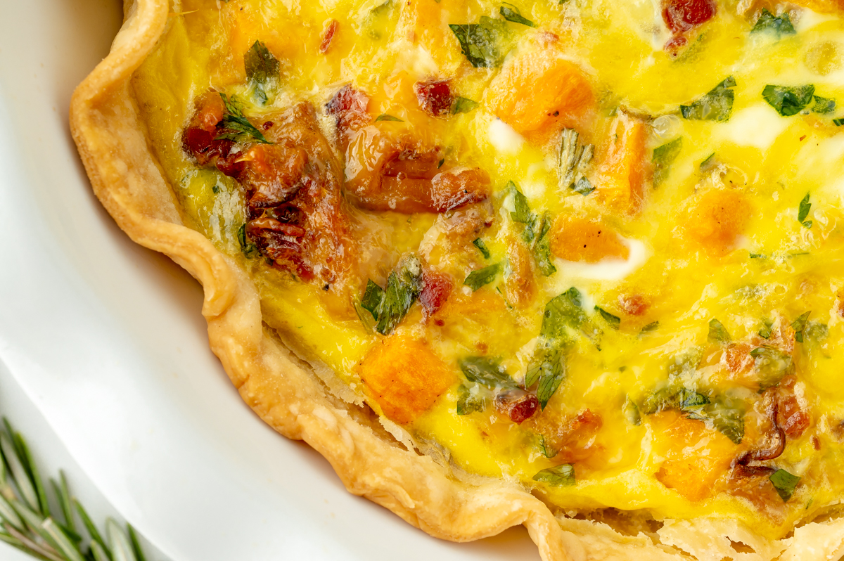 close up overhead shot of edge of sweet potato quiche