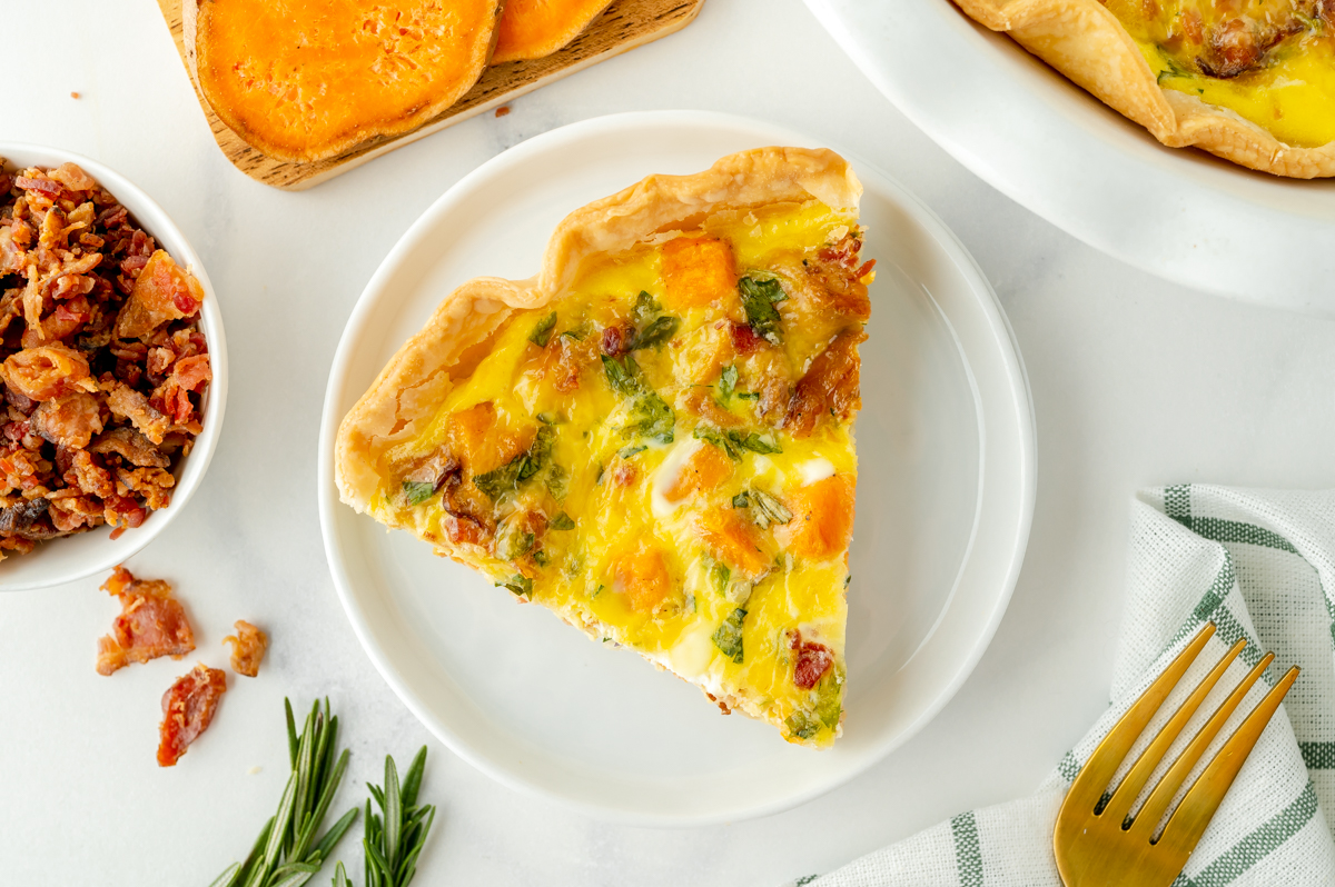 overhead shot of slice of quiche on plate