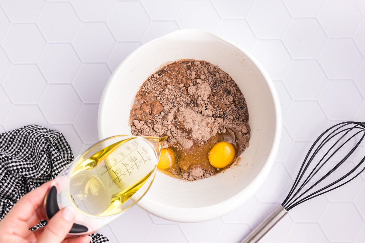 cake batter ingredients added to bowl