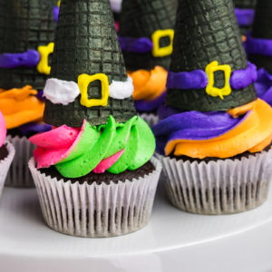 close up of platter of witch hat cupcakes