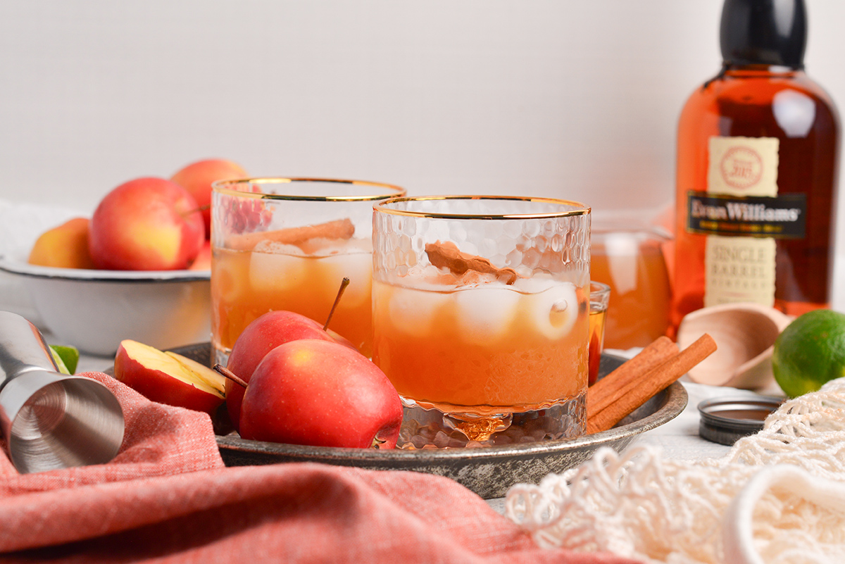 straight on shot of two apple cider whiskey cocktails