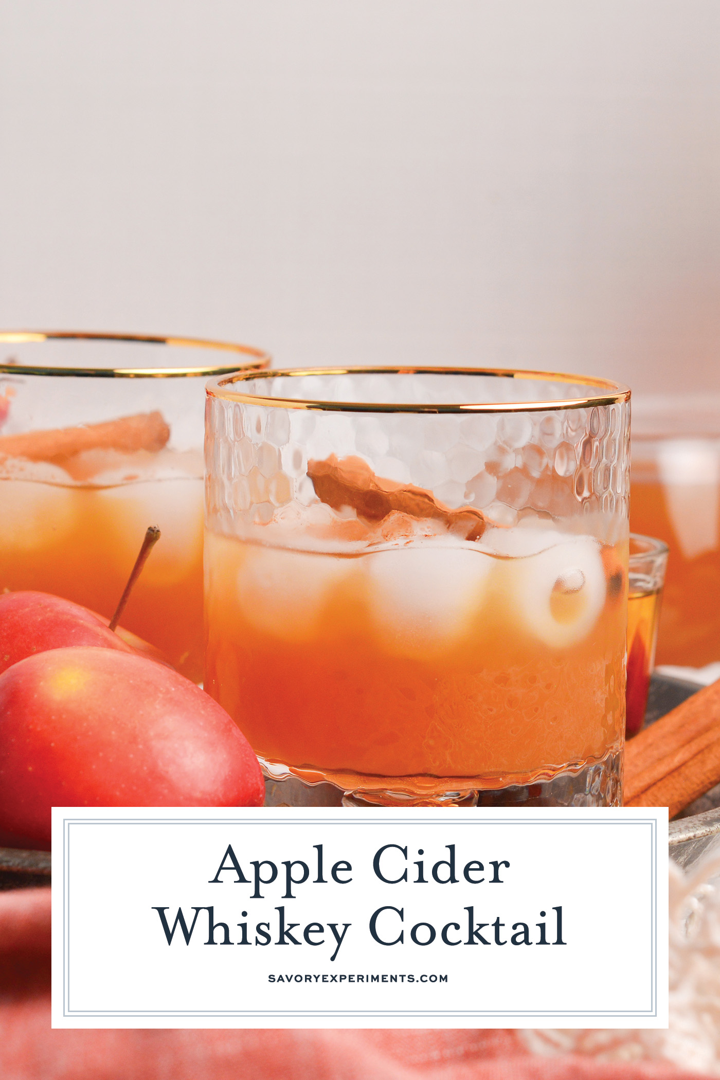 straight on shot of apple cider whiskey cocktail with text overlay