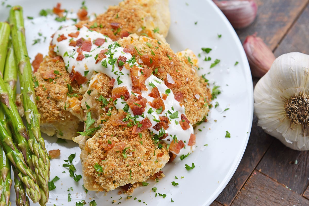 A plate of food, with Bacon and Chicken