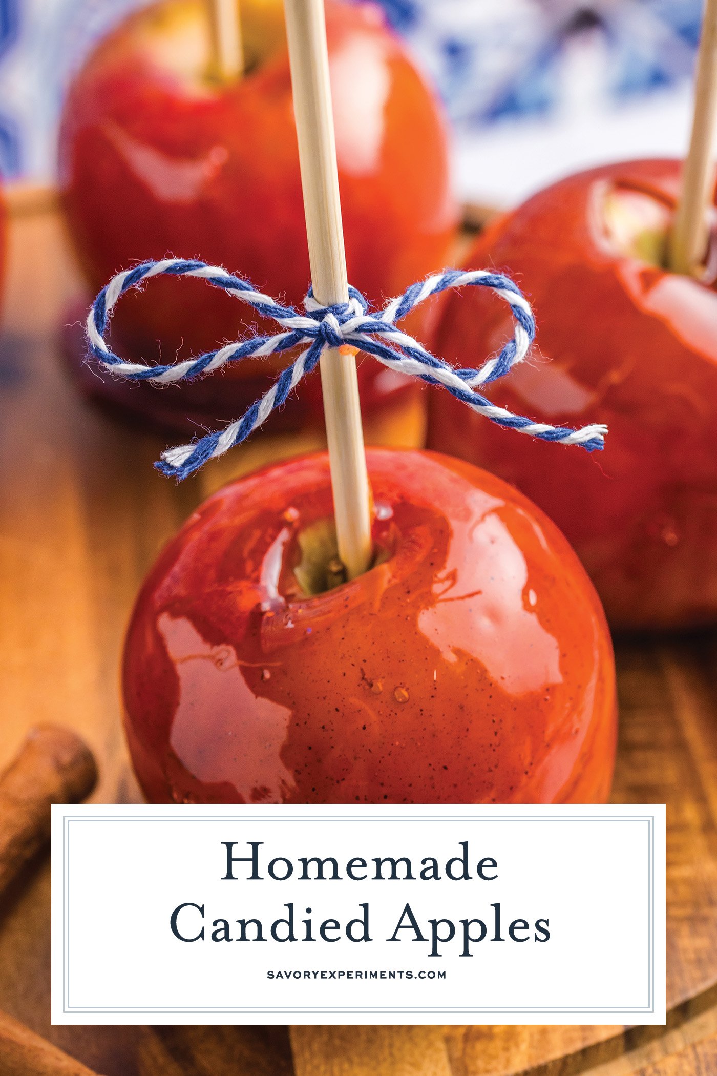 angled shot of candied apple tied with bow with text overlay