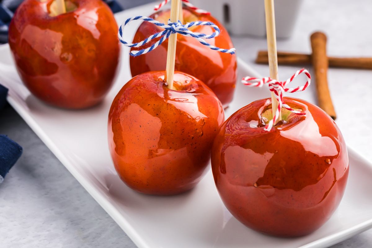 close up angled shot of tray of candied apples