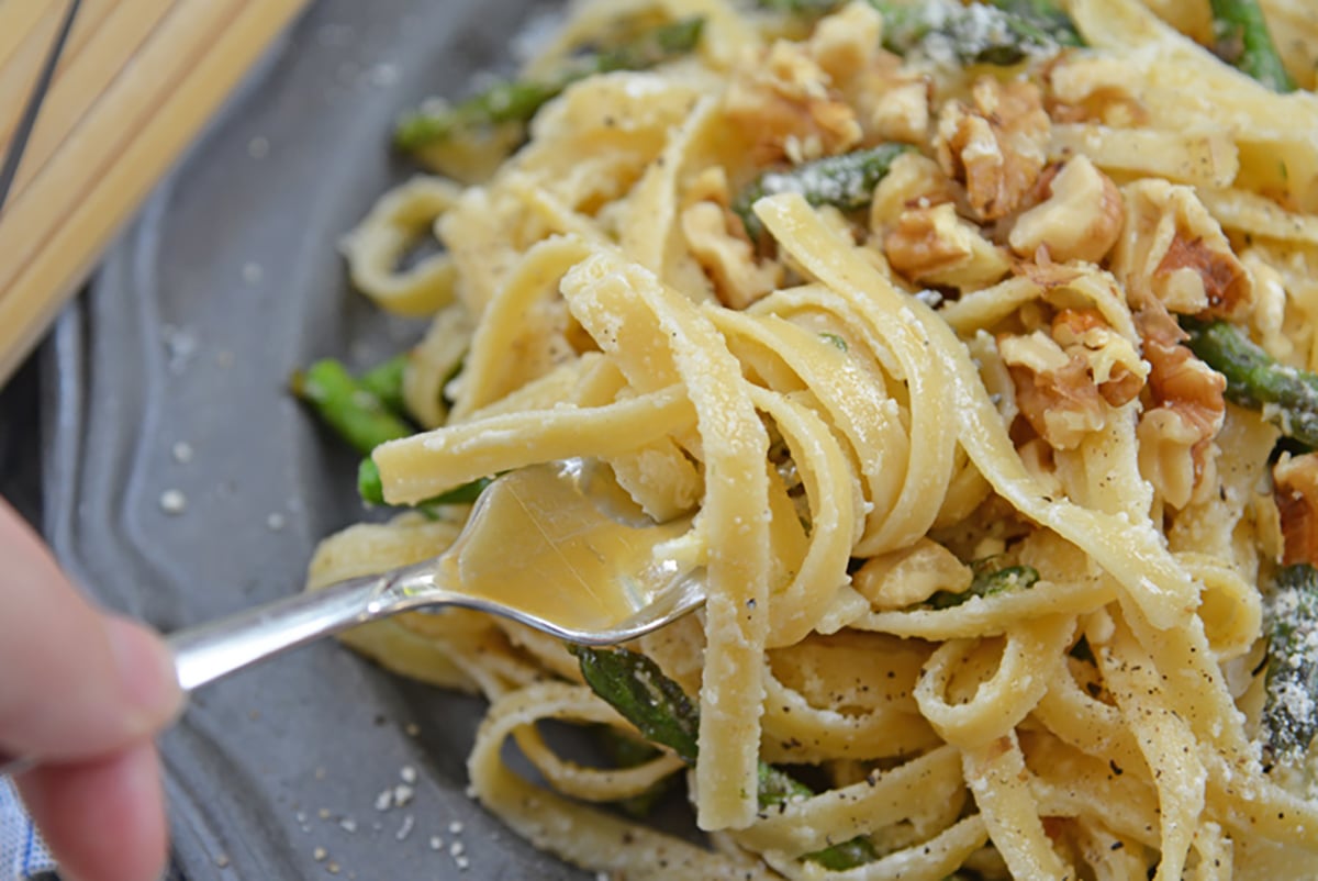 A close up of pasta on fork