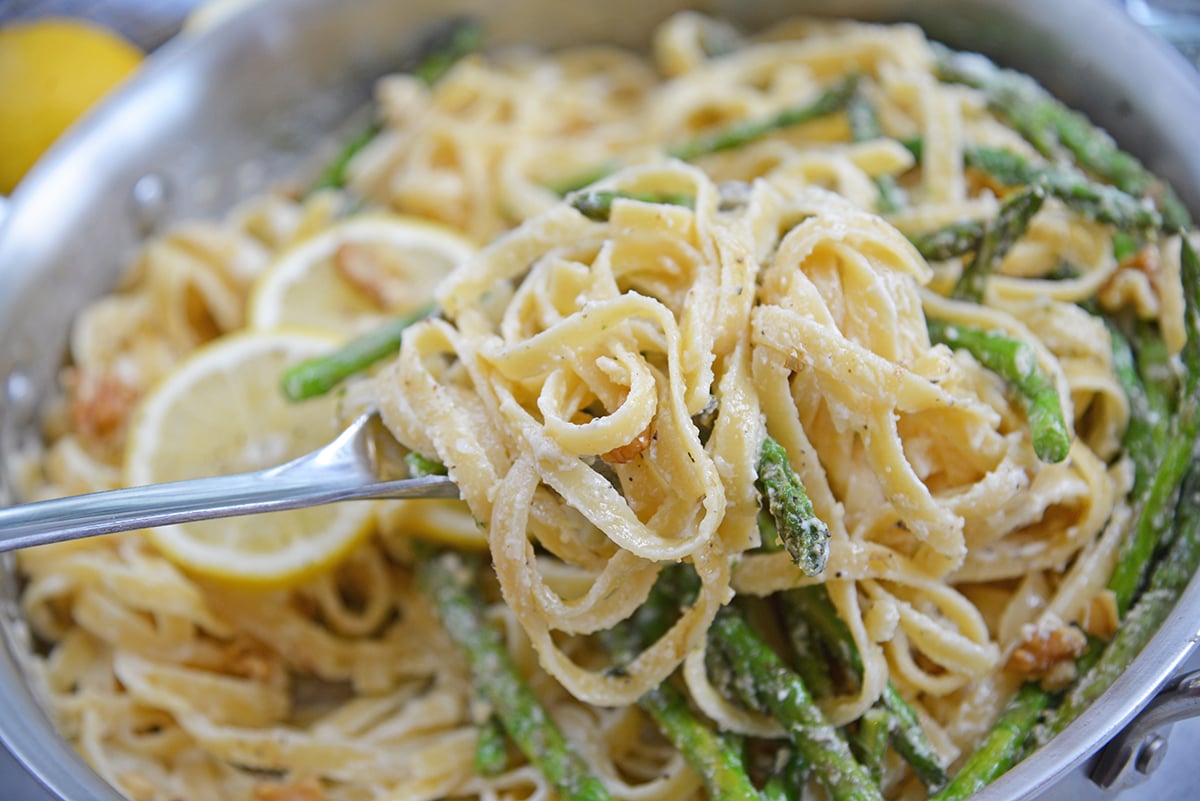 A bowl filled with pasta and Cream and Sauce