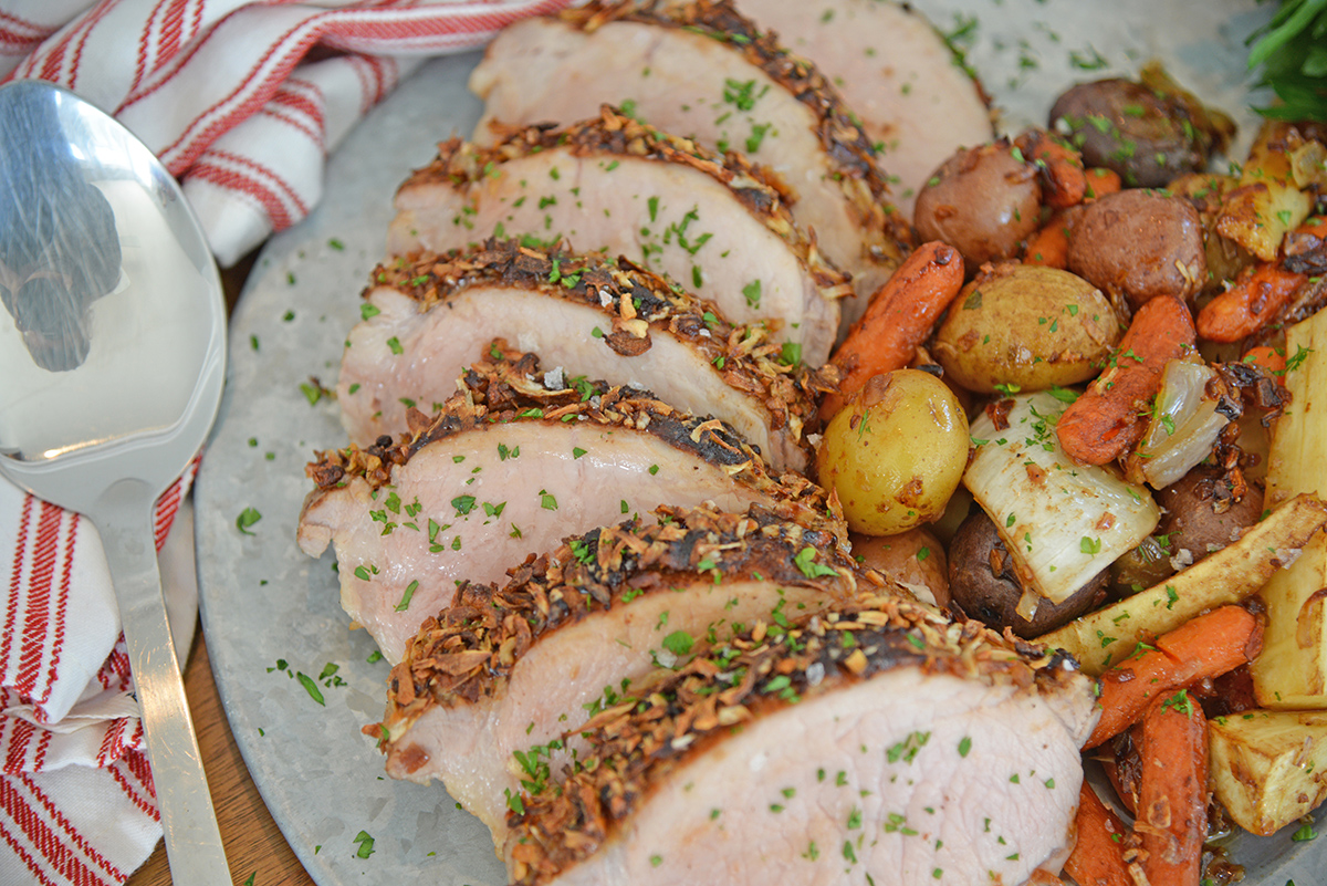 close up angled shot of sliced french onion pork loin