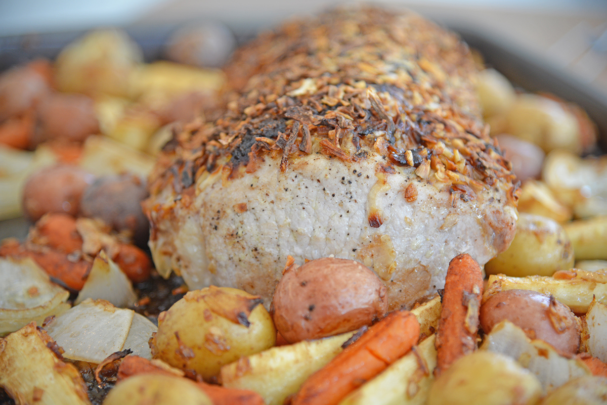 Side angle of French Onion Pork Loin on a baking sheet