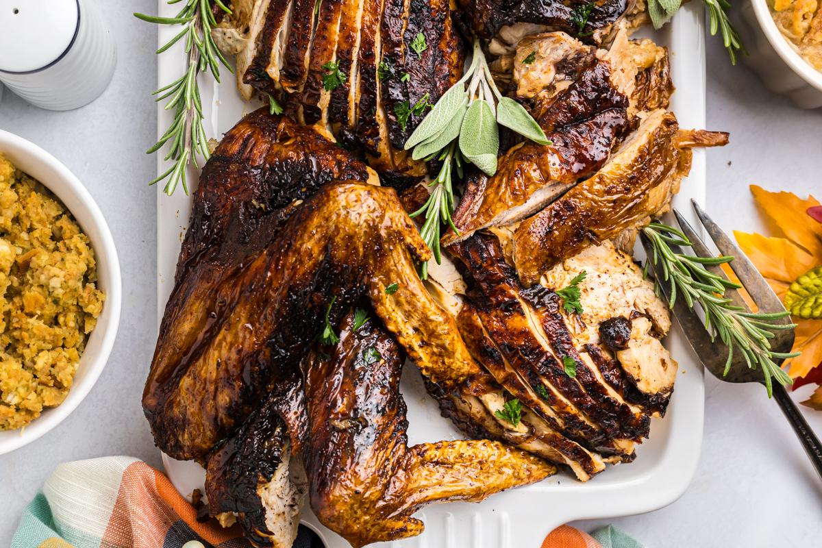 overhead shot of sliced fired turkey on serving dish