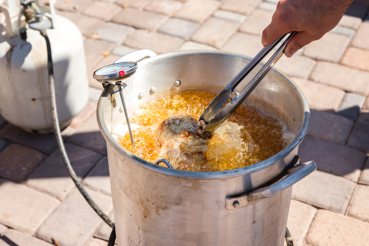 turkey added to deep fryer