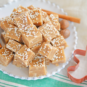 Gingerbread fudge squares on a white plate with red gingerbread man cookie cutter