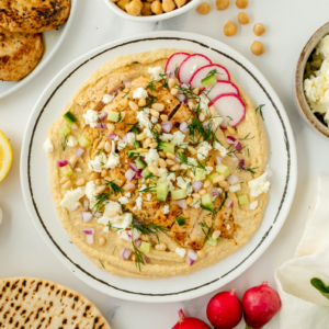 overhead shot of greek chicken hummus bowl