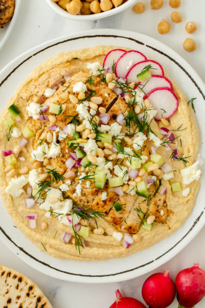 overhead shot of greek chicken hummus bowl