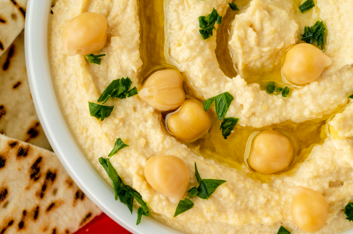 close up overhead shot of bowl of homemade hummus