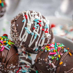 close up angled shot of bowl of hot chocolate bombs