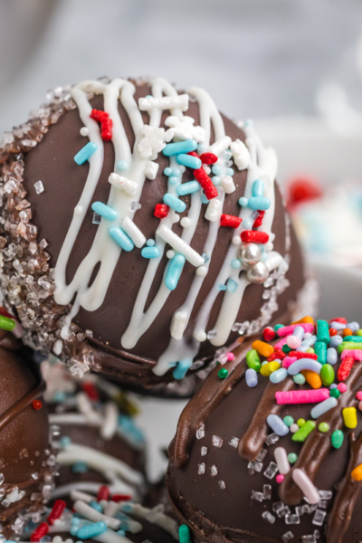 close up angled shot of bowl of hot chocolate bombs