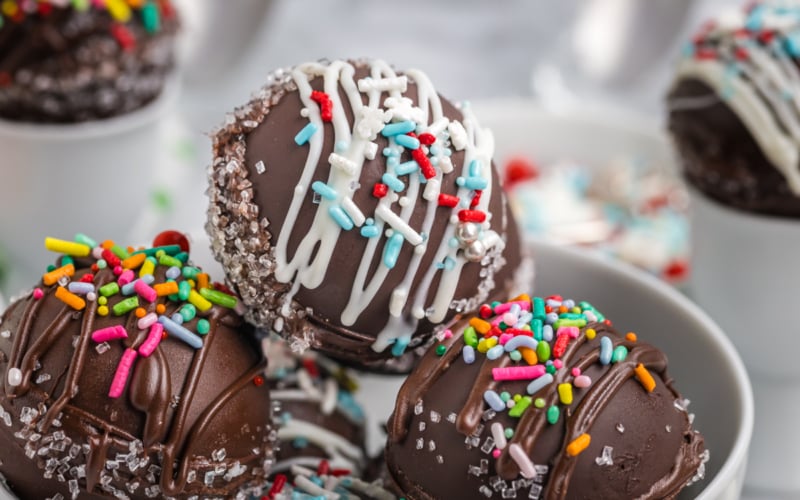 close up angled shot of bowl of hot chocolate bombs