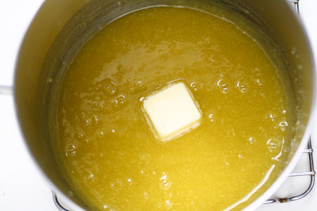 lemon curd cooking in a saucepan