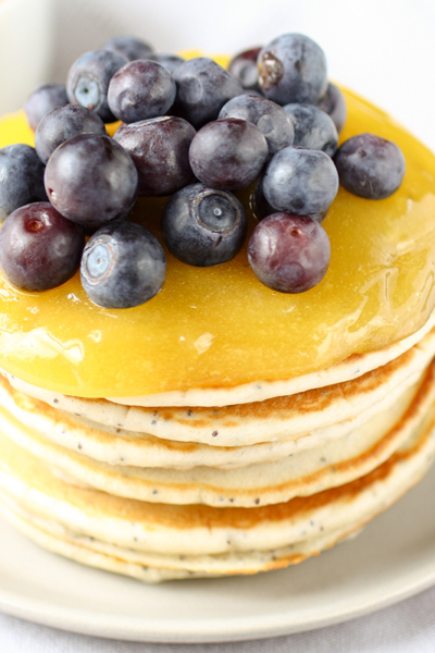 stack of pancakes with lemon curd and blueberries