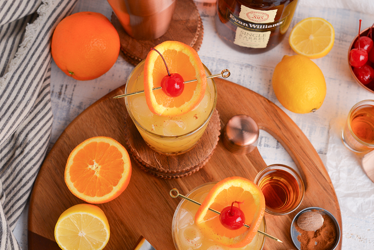 overhead shot of two maple whiskey sour cocktails