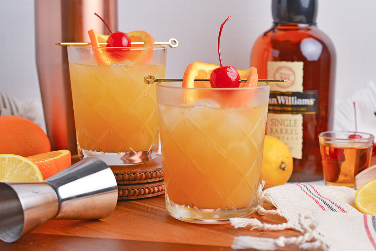 straight on shot of two maple whiskey sour cocktails