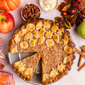 overhead shot of sliced pumpkin apple pie