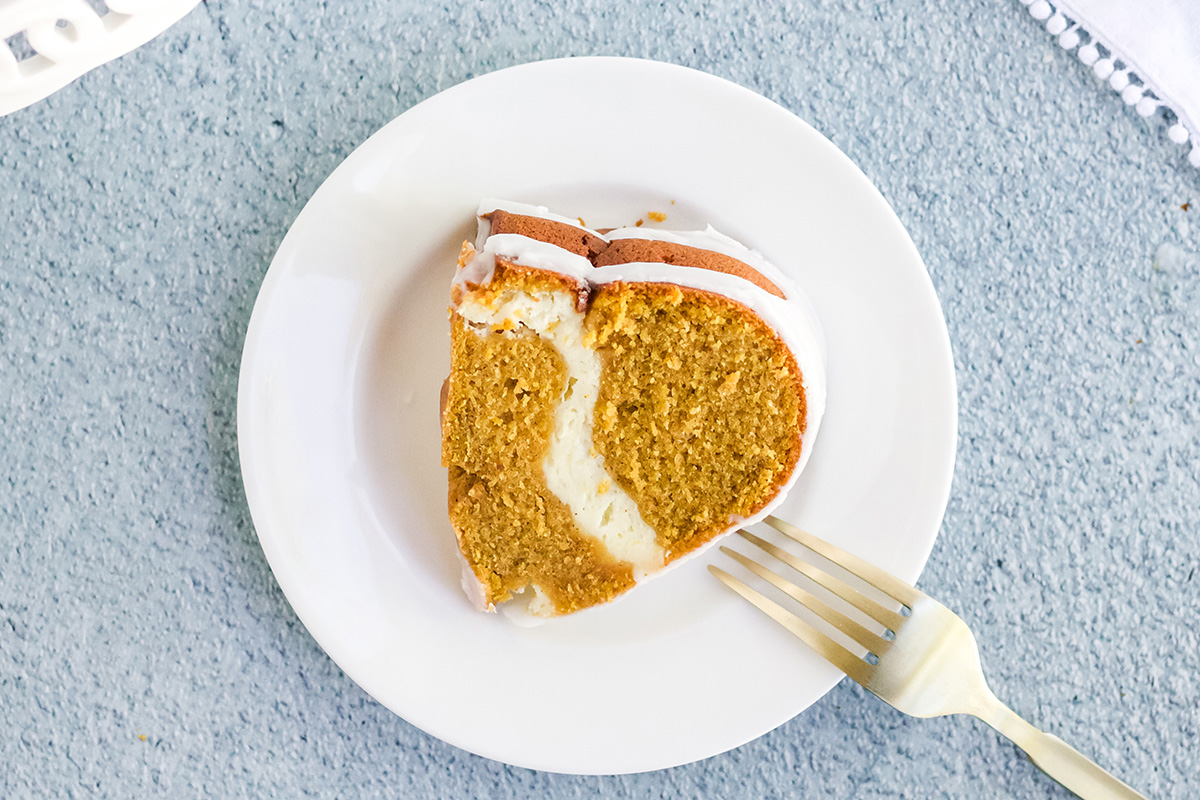 overhead shot of slice of pumpkin cream cheese pound cake on plate