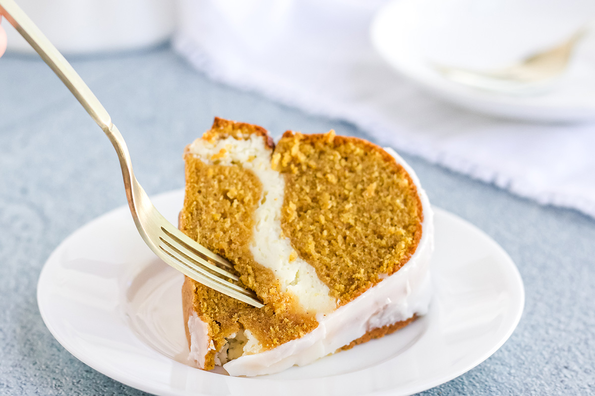 fork digging into slice of pumpkin cream cheese pound cake