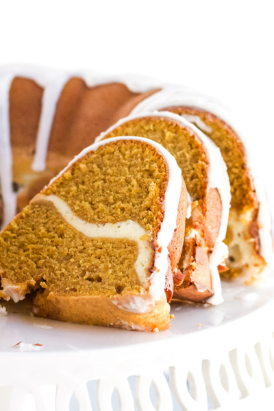 sliced pumpkin cream cheese pound cake on cake stand