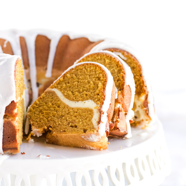 sliced pumpkin cream cheese pound cake on cake stand