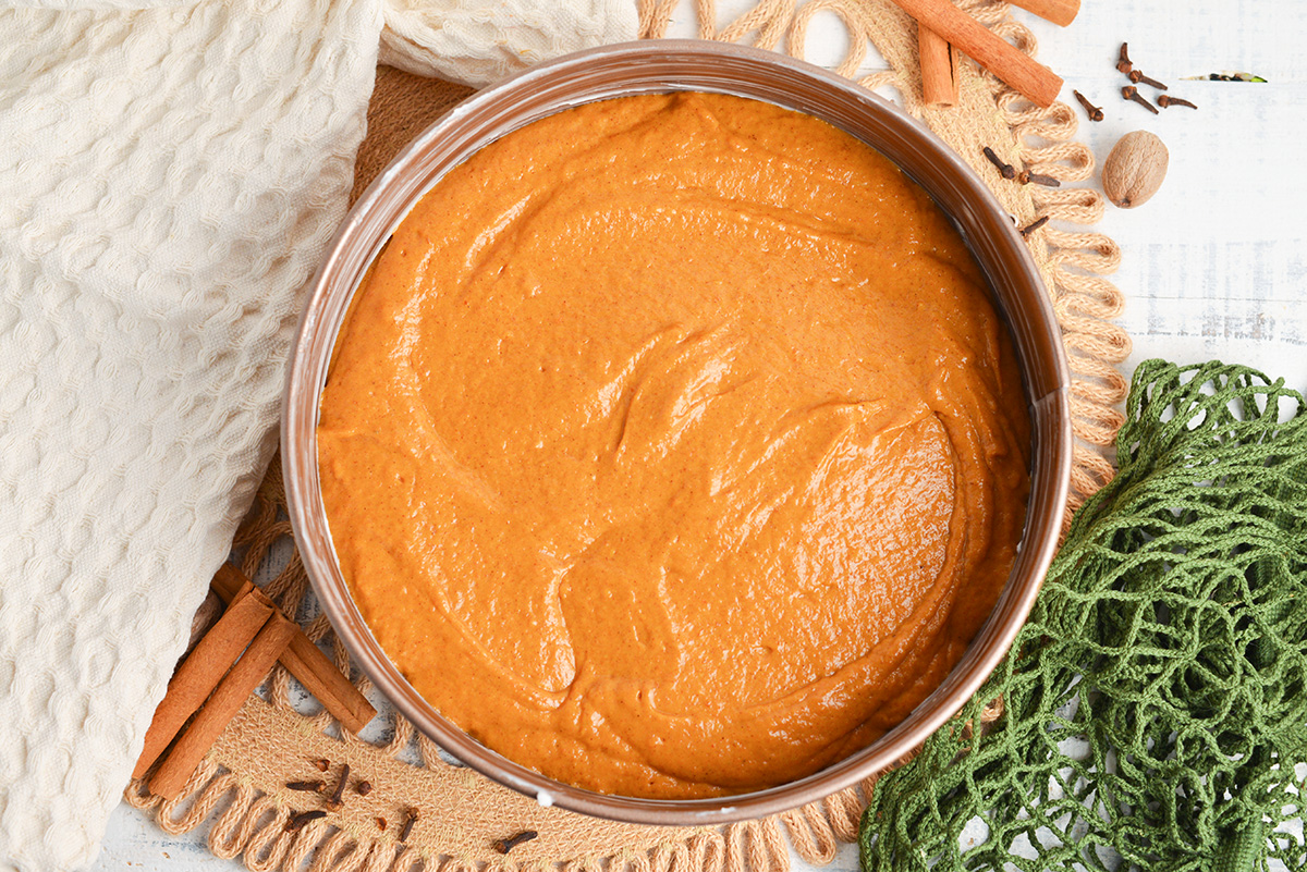 overhead shot of pumpkin cake batter in pan