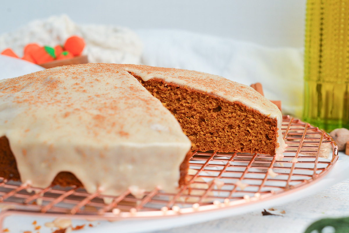 straight on shot of slice taken out of pumpkin olive oil cake